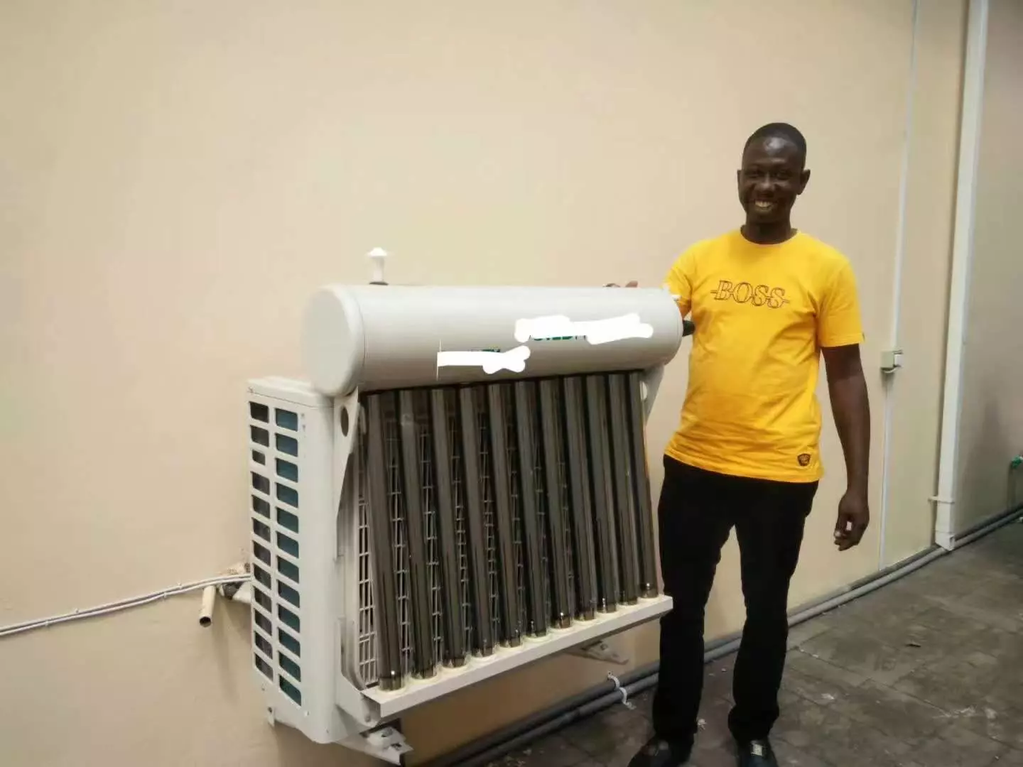 Happy customer using hybrid vacuum tube solar air conditioners
